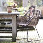 Contemporary Nordic Handwoven Natural Rattan Lounge Chair - Accent Chair With Ergonomic Backrest & Iron Base For Indoor & Outdoor Living Lumendat