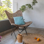 Contemporary Scandinavian Handwoven Rattan Lounge Chair - Accent Chair With Ergonomic Backrest & Iron Base For Boutique Indoor & Outdoor Spaces Lumendat